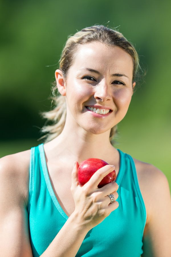 image of a woman smiling after iv therapy treatment