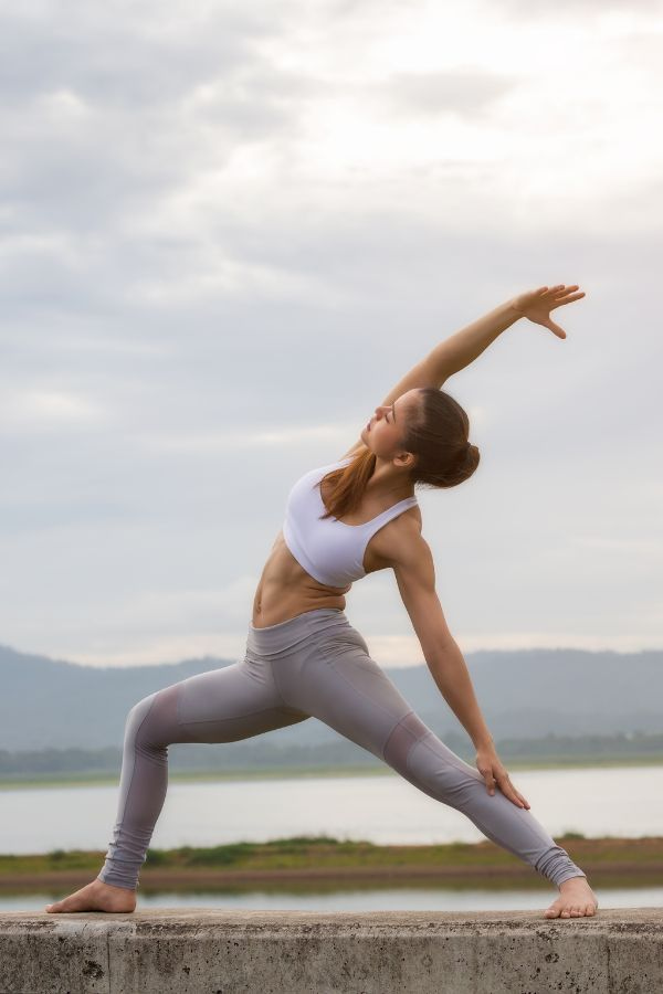 image of a woman holding a yoga pose after iv therapy treatment